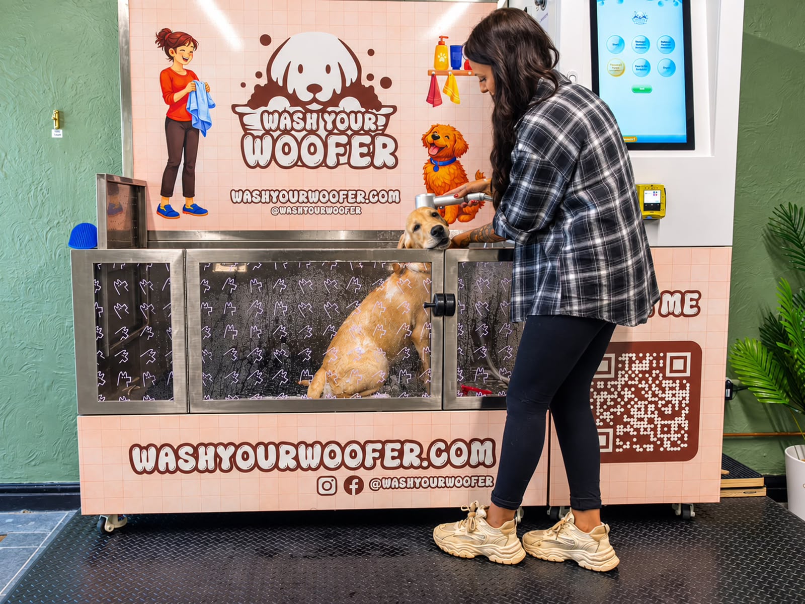 Women washing her dog at Wash Your Woofer